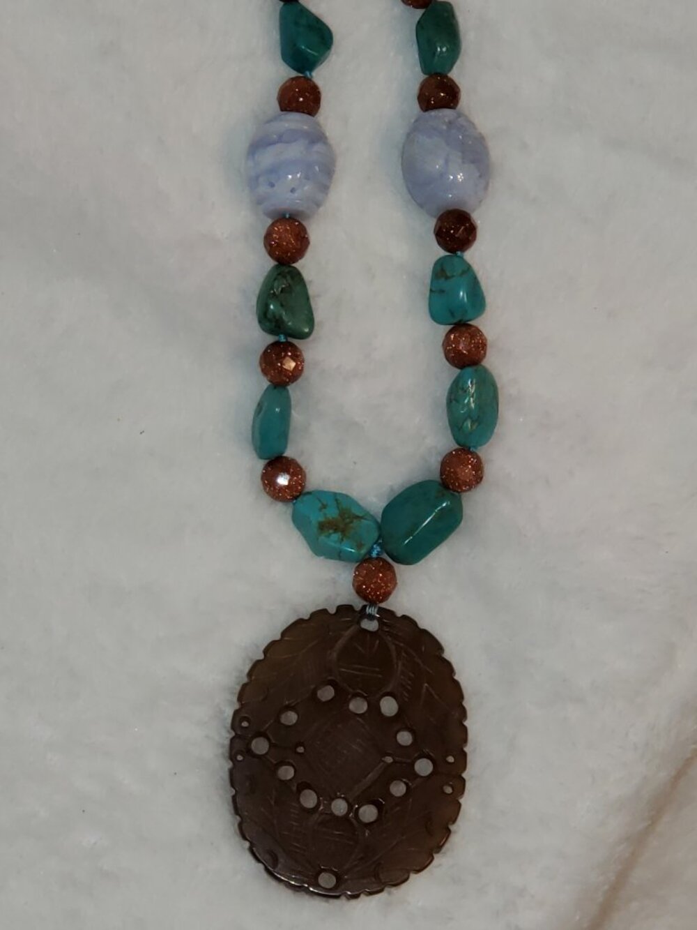 Vintage Prosperity necklace Carved pendant on turquoise/copper colored stones